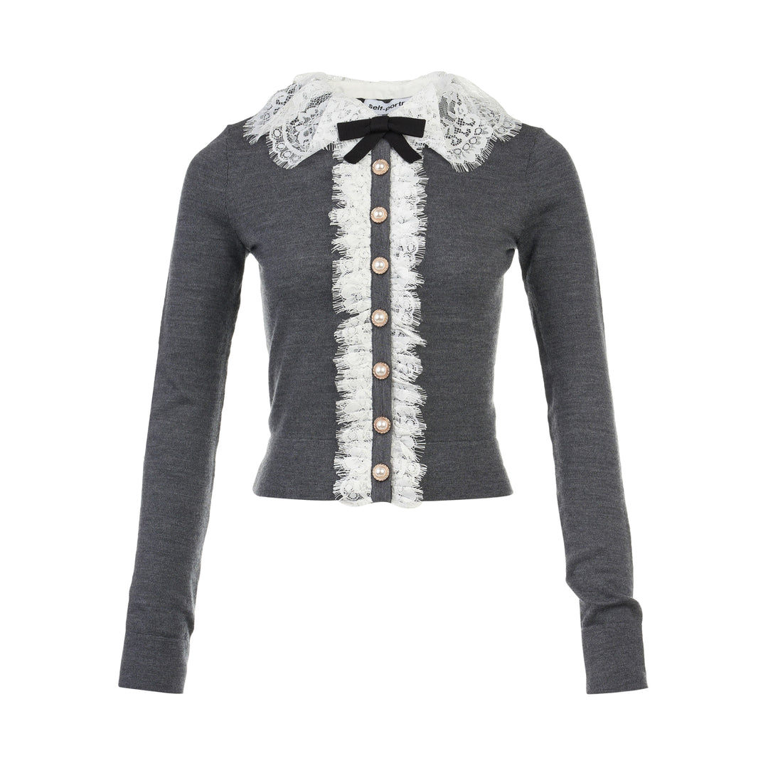 Self-Portrait grey knit cardigan with white lace Peter Pan collar, black velvet bow, scalloped lace placket trim, and pearl button fastening
