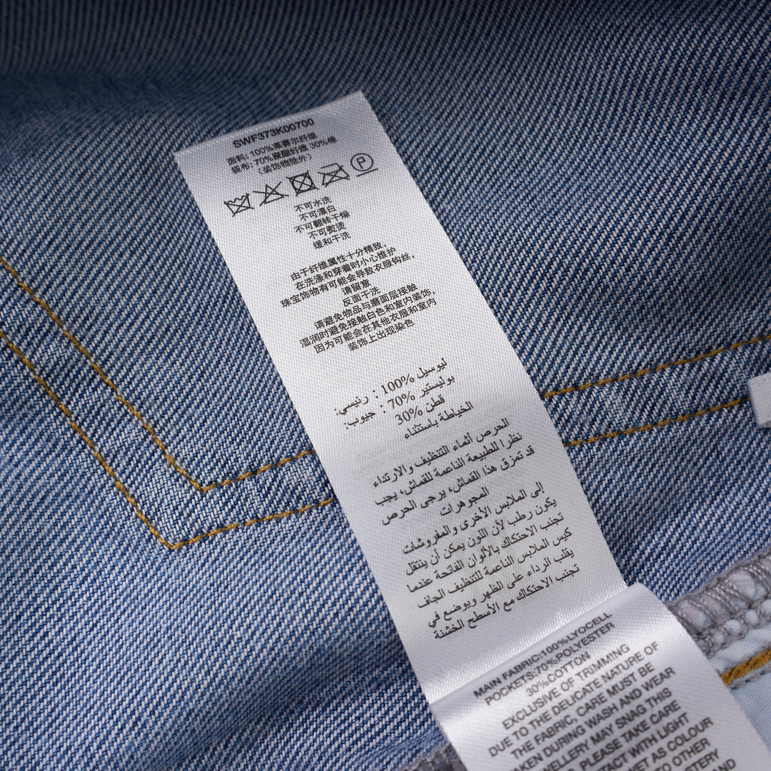 Self-Portrait light blue wide-leg jeans with rhinestone pinstripes and embroidered bow motifs on a white background - view 7