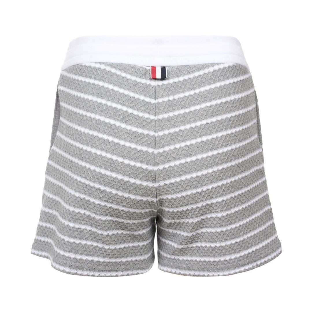 Thom Browne grey and white striped honeycomb-textured knit shorts with white ribbed waistband, drawstring tie with stripe detail, and woven brand label at hem - view 2