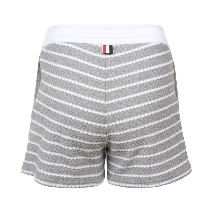Thom Browne grey and white striped honeycomb-textured knit shorts with white ribbed waistband, drawstring tie with stripe detail, and woven brand label at hem - view 2