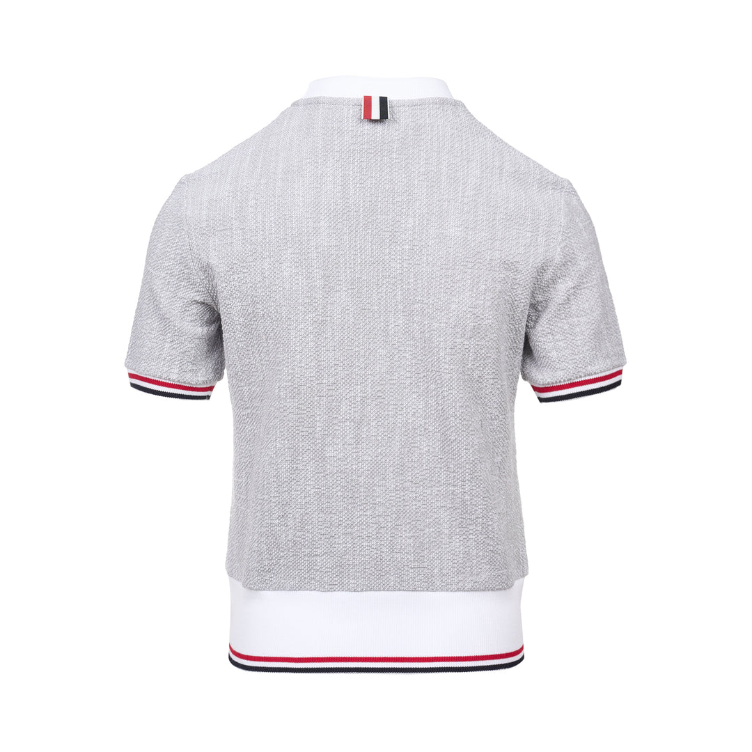 Thom Browne heather grey textural knit short sleeve tee with red, white, and blue striped tipping on sleeve cuffs and hem, white ribbed crew neck and hem band, and woven brand label on chest - view 2