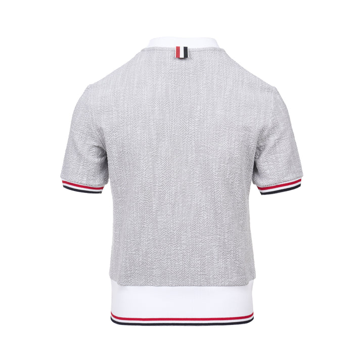 Thom Browne heather grey textural knit short sleeve tee with red, white, and blue striped tipping on sleeve cuffs and hem, white ribbed crew neck and hem band, and woven brand label on chest - view 2
