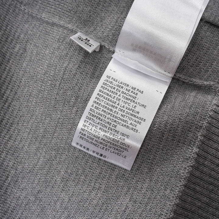 Thom Browne heather grey V-neck cardigan with four-bar white stripe detail on sleeve, button-through front, and ribbed hem and cuffs - view 5