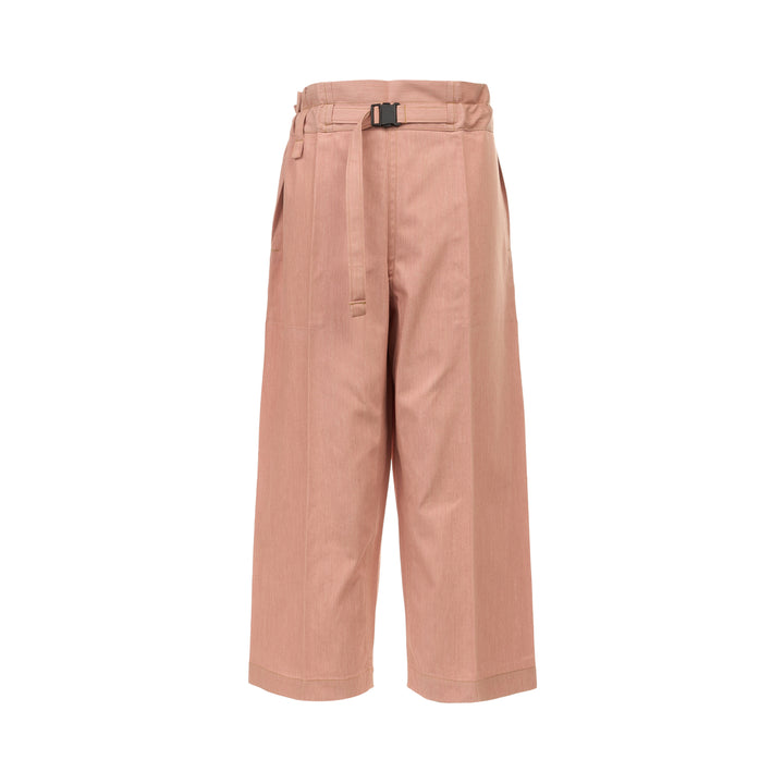 me Issey Miyake Flat Denim Seasonal Pants in dusty rose — wide-leg culotte silhouette with front pleats, utility clip buckle waistband, and cuffed hem, shown flat against a white background