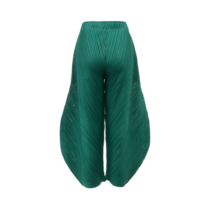 Pleats Please Issey Miyake Thicker Bottoms Pleated Pants in emerald green, displayed flat to show voluminous diagonal-pleated harem silhouette tapering at the ankle - view 2