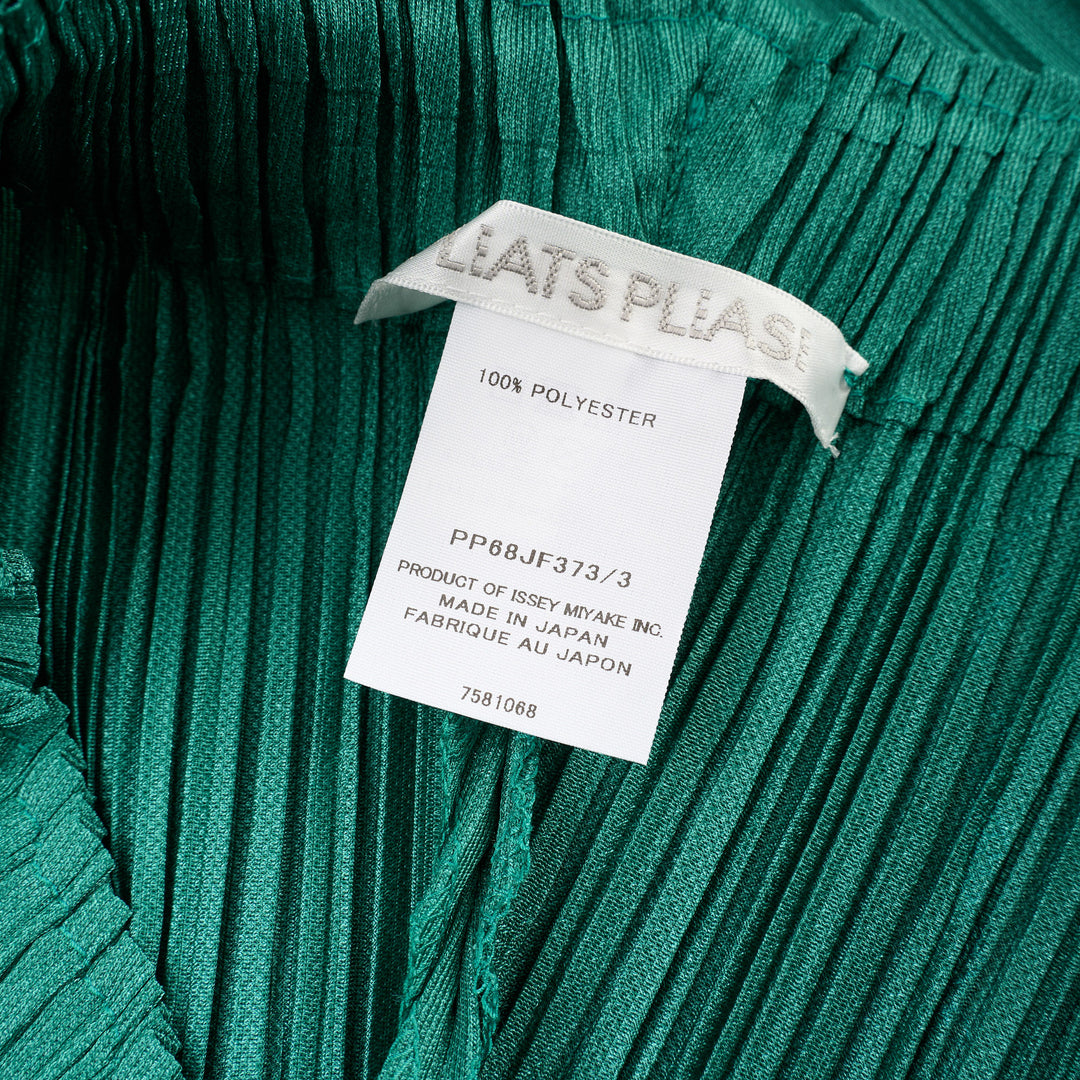 Pleats Please Issey Miyake Thicker Bottoms Pleated Pants in emerald green, displayed flat to show voluminous diagonal-pleated harem silhouette tapering at the ankle - view 3