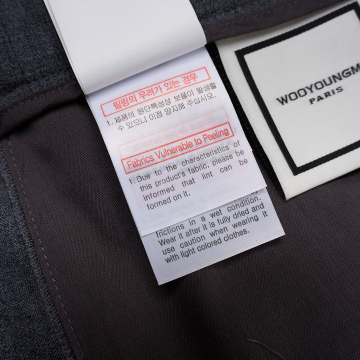Wooyoungmi Elastic Waist Slim Pants in grey mélange fabric with ribbed knit cuffs and metal hardware detail at the waistband, front view - view 5