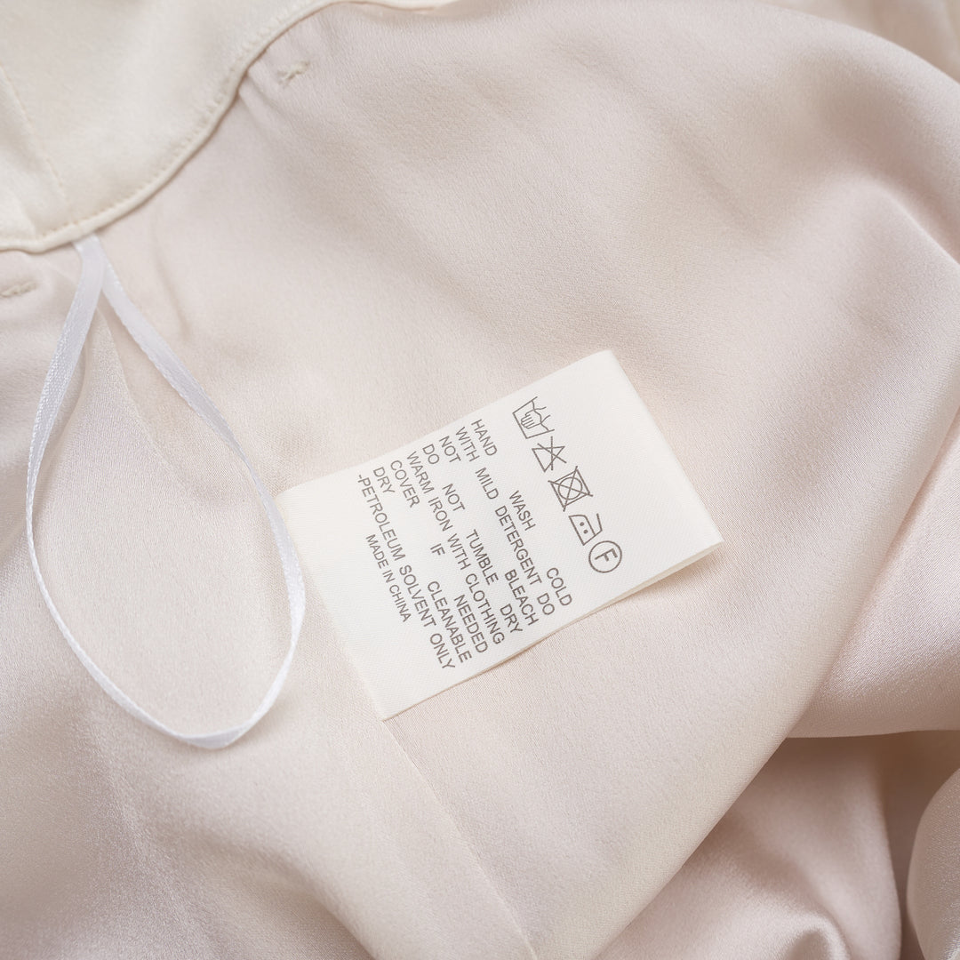 Cream wide-leg high-rise cargo pants in crepe acetate blend with flap pockets and pressed front crease - view 3