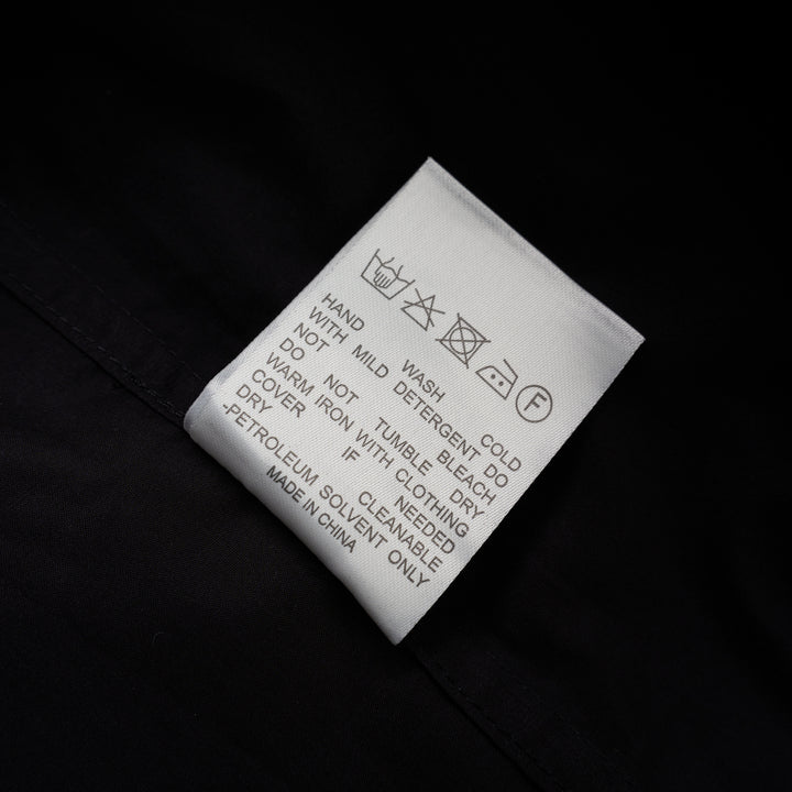 Black cotton tuxedo-style shirt with pleated bib front, concealed button placket and pointed collar from Club21 Collection - view 4