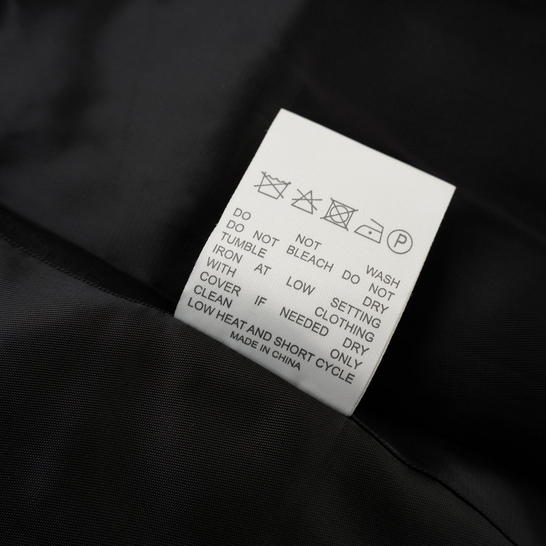 Black wool-mix tailored jacket with asymmetric button front, stand collar, welt chest pocket and flap hip pockets - view 4