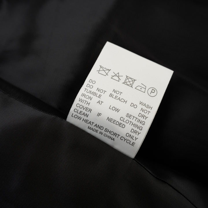 Black wool-mix tailored jacket with asymmetric button front, stand collar, welt chest pocket and flap hip pockets - view 4