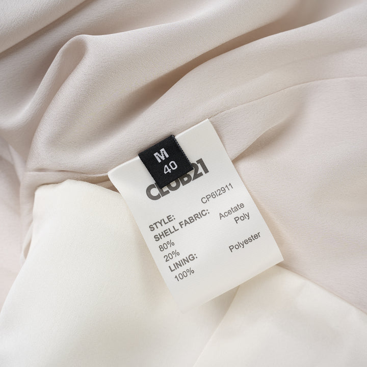 Ivory matte acetate mix maxi skirt with diagonal seam and flared hem, shown from the front - view 3