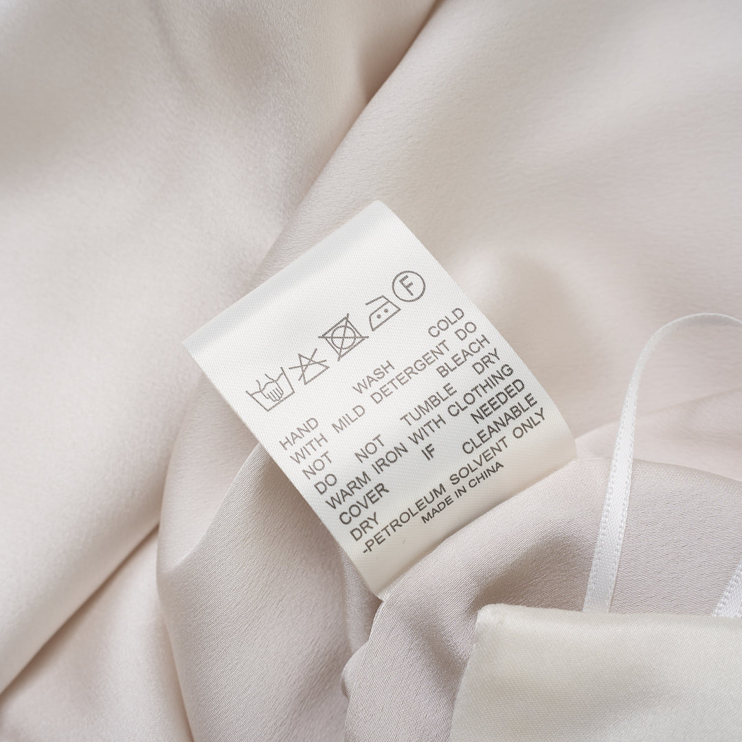 Ivory matte acetate mix maxi skirt with diagonal seam and flared hem, shown from the front - view 4