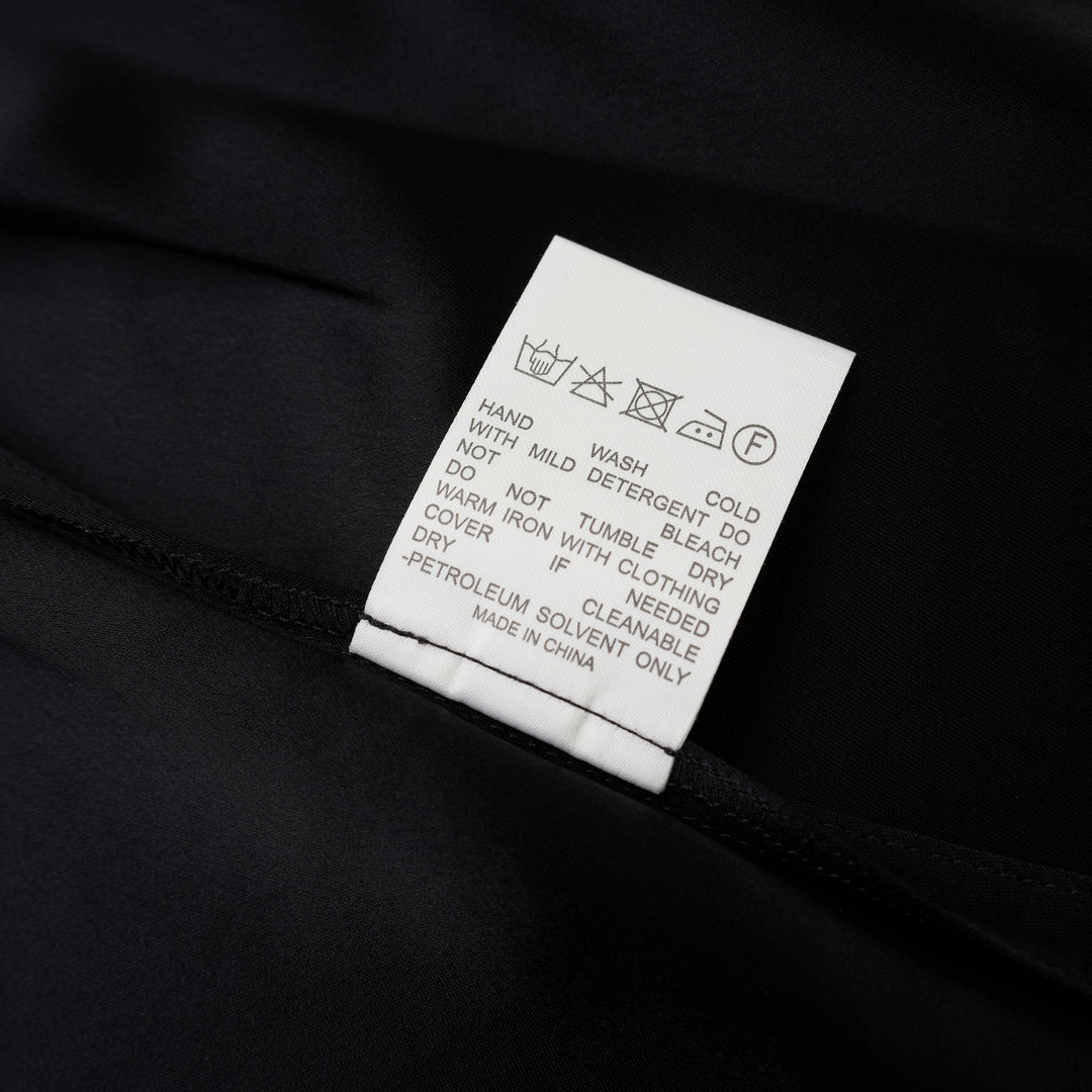 Black sleeveless satin wrap top with a V-neckline, tie waist and asymmetric draped hem from Club21 Collection - view 4