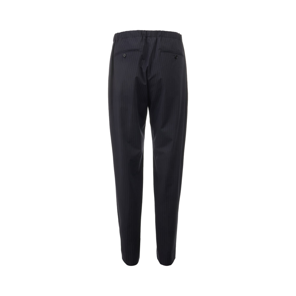 Undercover navy pinstripe slim tapered pants with elasticated waistband, displayed flat on a white background - view 2
