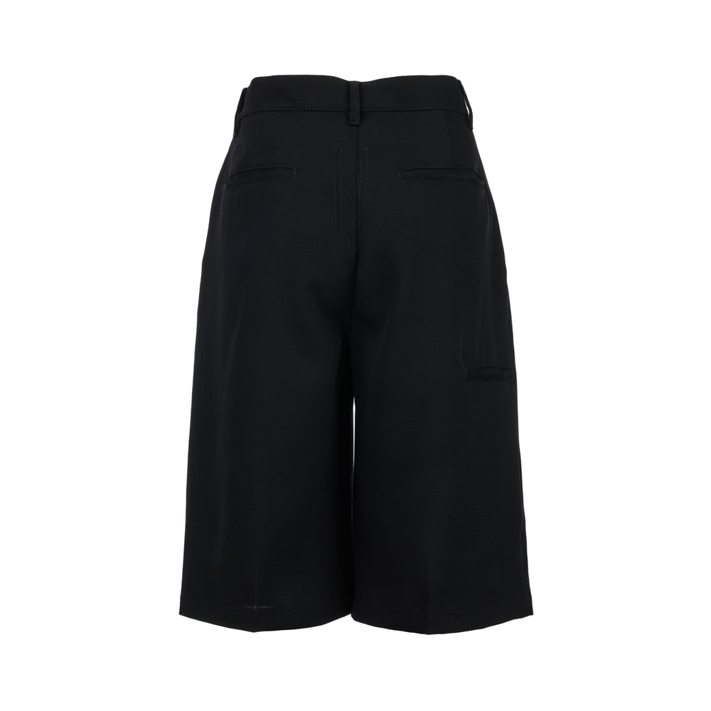 Rick Owens Work Shorts in black, featuring a high-rise waistband, button closure, and a relaxed knee-length silhouette, displayed flat on a white background