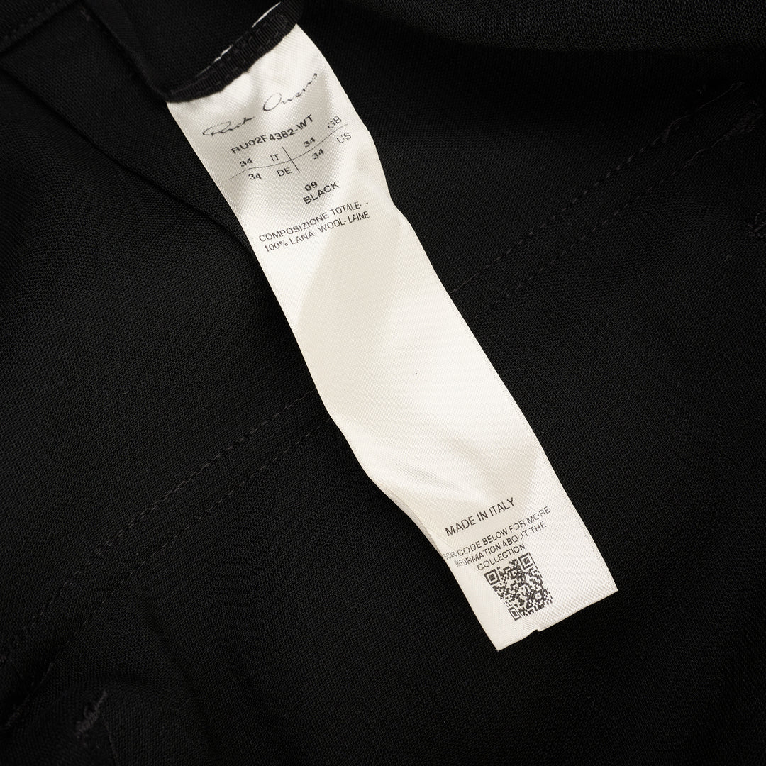 Rick Owens Stefan Cargo Twisted Shorts in black, featuring oversized patch pockets, raw-hem leg openings, and a silver snap button fastening at the waistband - view 3