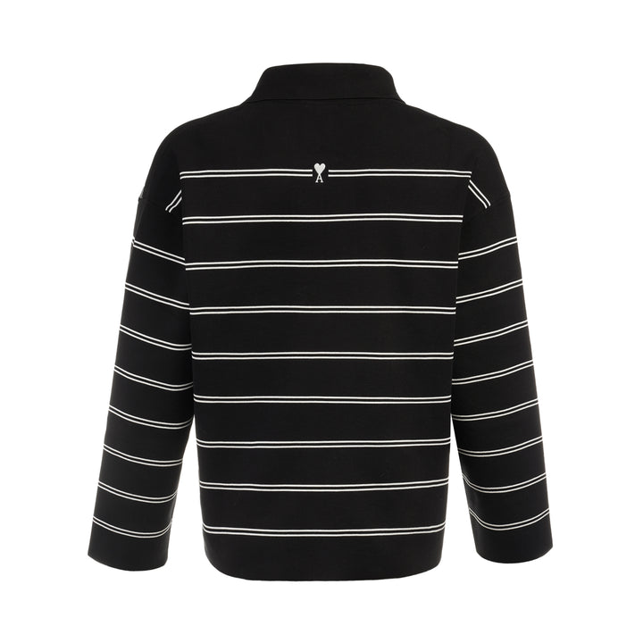AMI Alexandre Mattiussi Long Sleeve Striped Polo in black with white horizontal stripes, featuring a spread collar, half-zip placket with heart logo pull, and ribbed cuffs - view 2