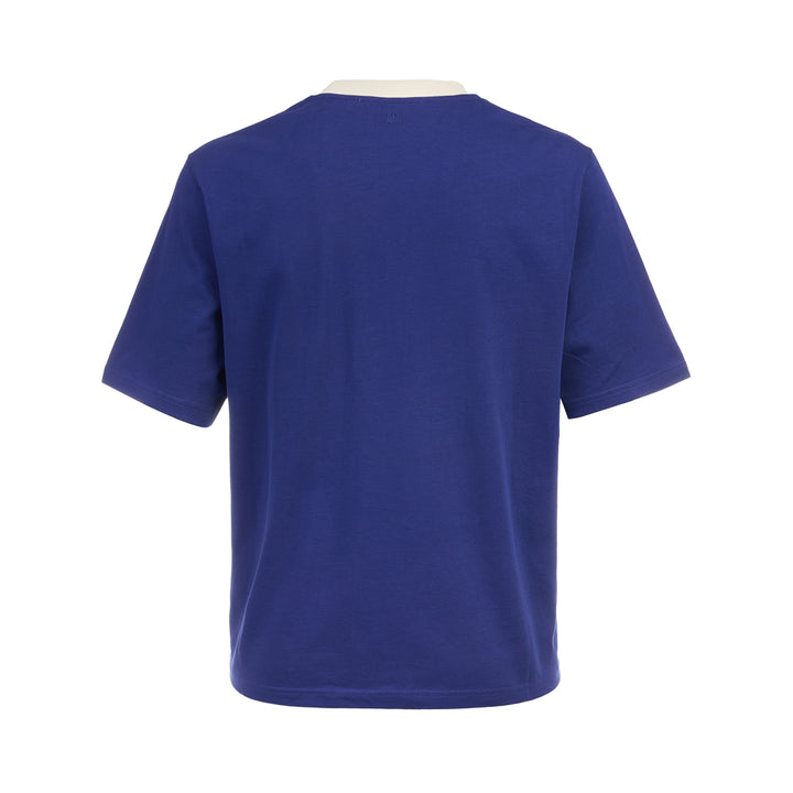 AMI royal blue cotton graphic T-shirt with 'Thank You For Being A Friend' slogan print in cream lettering, featuring a contrast cream ribbed crew neckline and AMI de Cœur logo at the hem - view 2