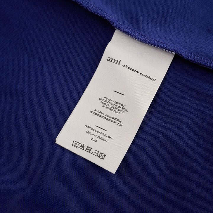 AMI royal blue cotton graphic T-shirt with 'Thank You For Being A Friend' slogan print in cream lettering, featuring a contrast cream ribbed crew neckline and AMI de Cœur logo at the hem - view 3