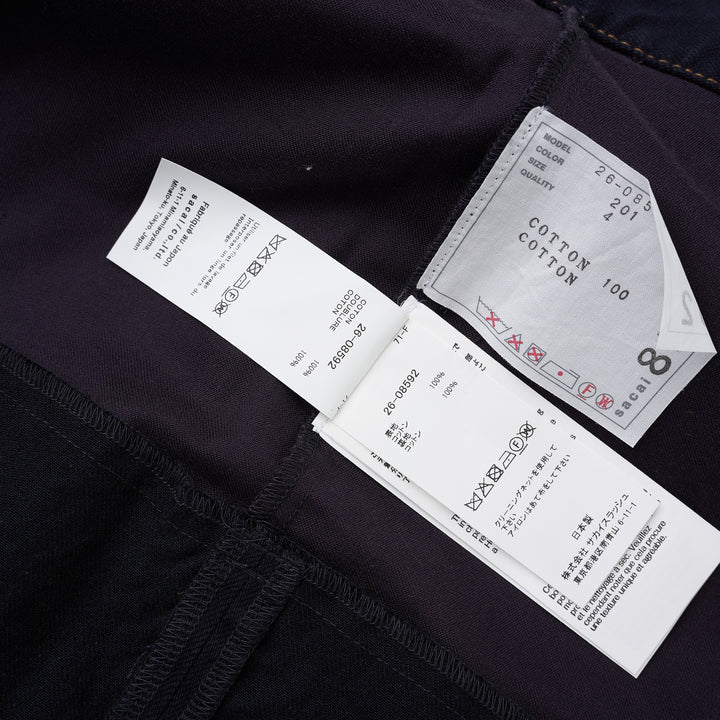 sacai belted peplum denim midi skirt in dark indigo with contrast topstitching, shown from the front - view 4