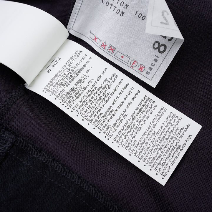 sacai belted peplum denim midi skirt in dark indigo with contrast topstitching, shown from the front - view 8