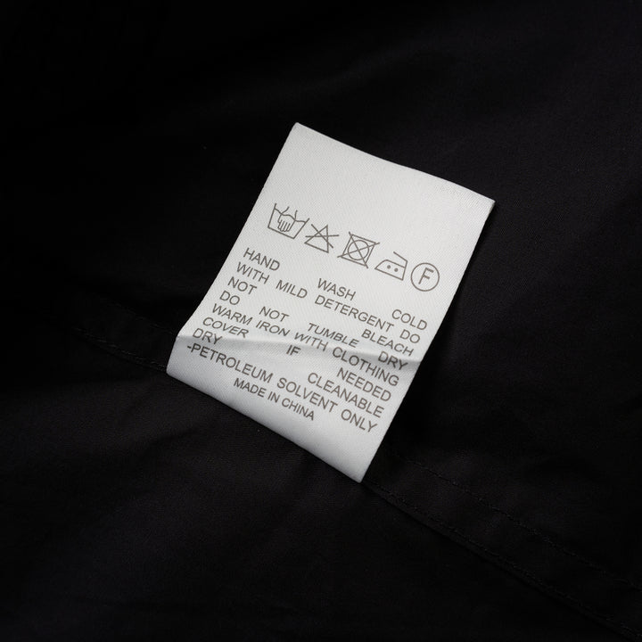 Black sleeveless cotton shirt with pintucked bib front, mandarin collar and self-fabric waist tie - view 4