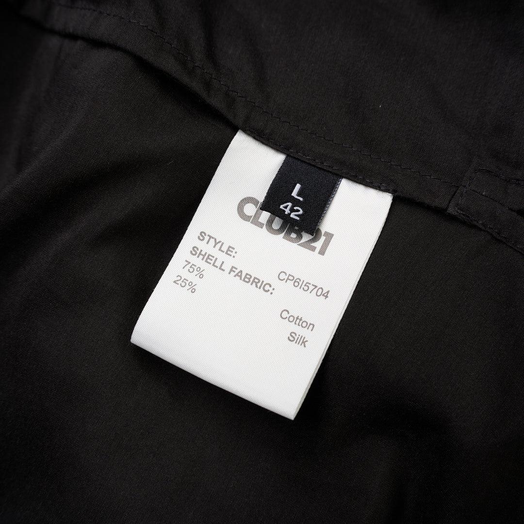 Black sheer silk cotton button-up shirt with stand collar and extended long sleeve cuffs, front view - view 3