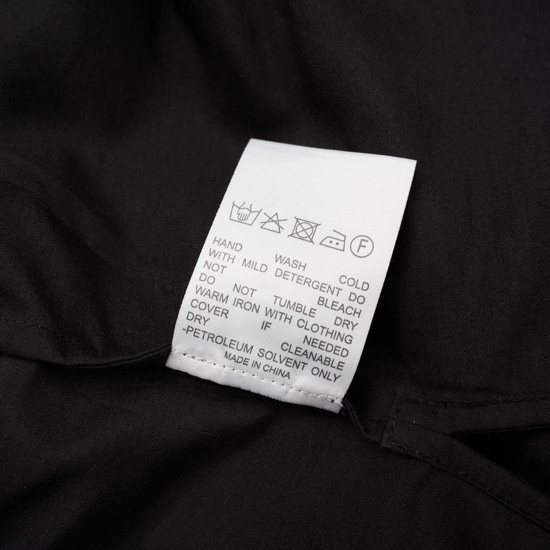 Black sheer silk cotton button-up shirt with stand collar and extended long sleeve cuffs, front view - view 4