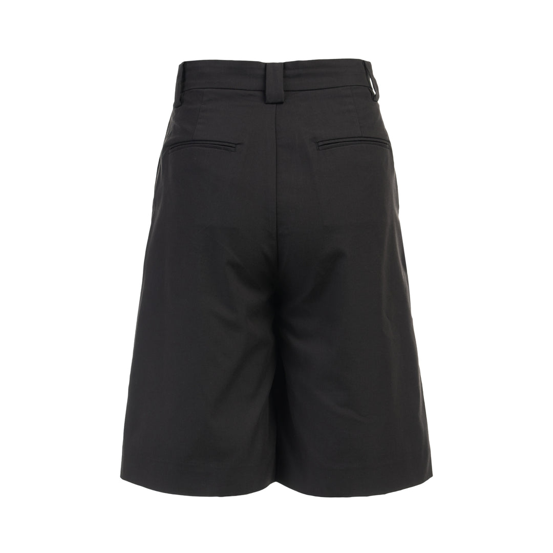 Black longline tailored shorts with a front box pleat, belt loops and concealed fly closure, shown from the front - view 2