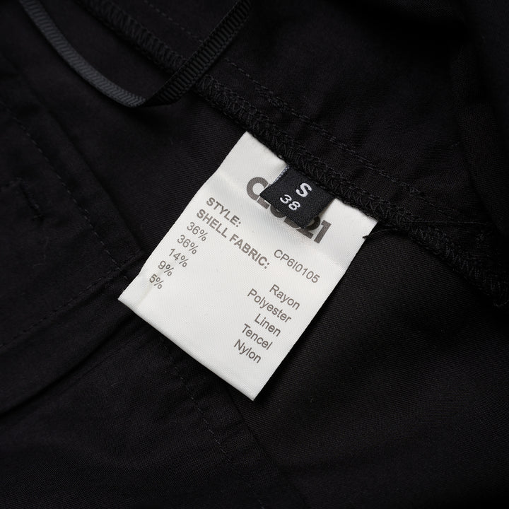 Black longline tailored shorts with a front box pleat, belt loops and concealed fly closure, shown from the front - view 3