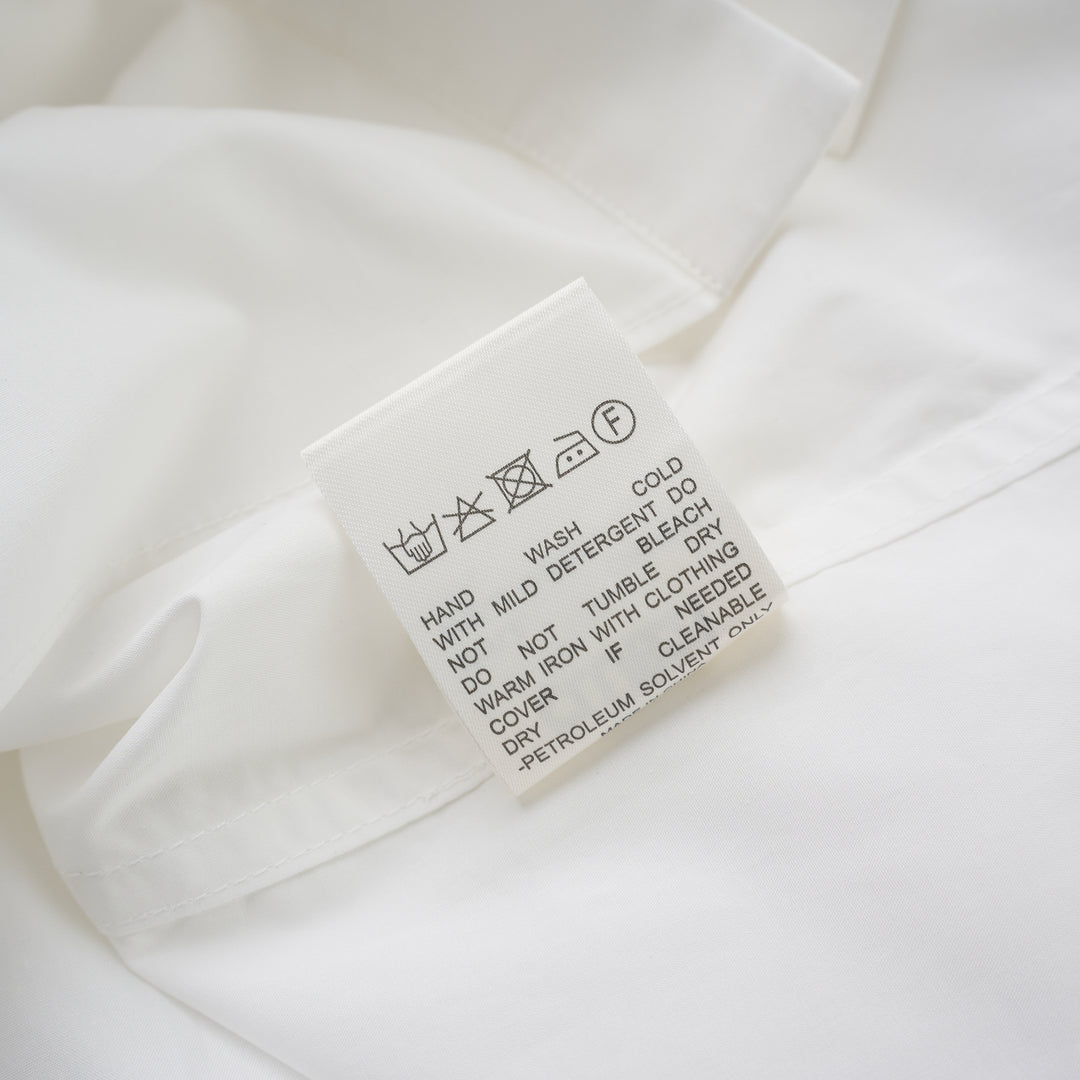 White structured cotton tuxedo shirt with pintucked bib front, pointed collar, concealed placket and long buttoned-cuff sleeves - view 3