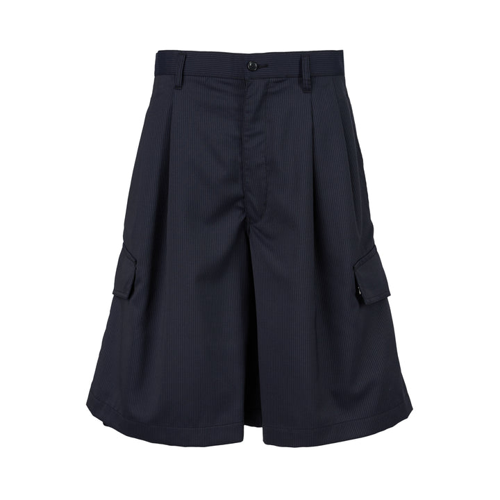 Navy pinstripe pleated cargo shorts by Comme des Garçons Shirt with a wide-leg cut, flap pockets and button fly, shown from the front