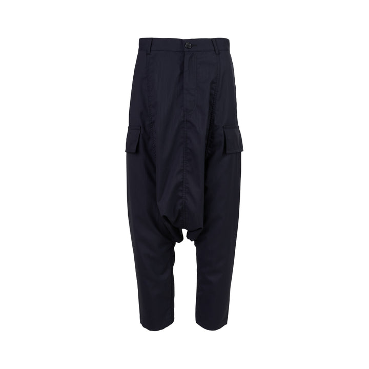 Comme des Garçons Shirt dark navy striped drop-crotch cargo pants with flap side pockets and cropped legs, shown from the front