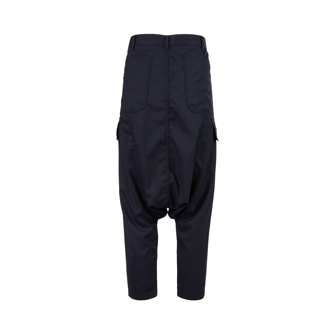 Comme des Garçons Shirt dark navy striped drop-crotch cargo pants with flap side pockets and cropped legs, shown from the front - view 2