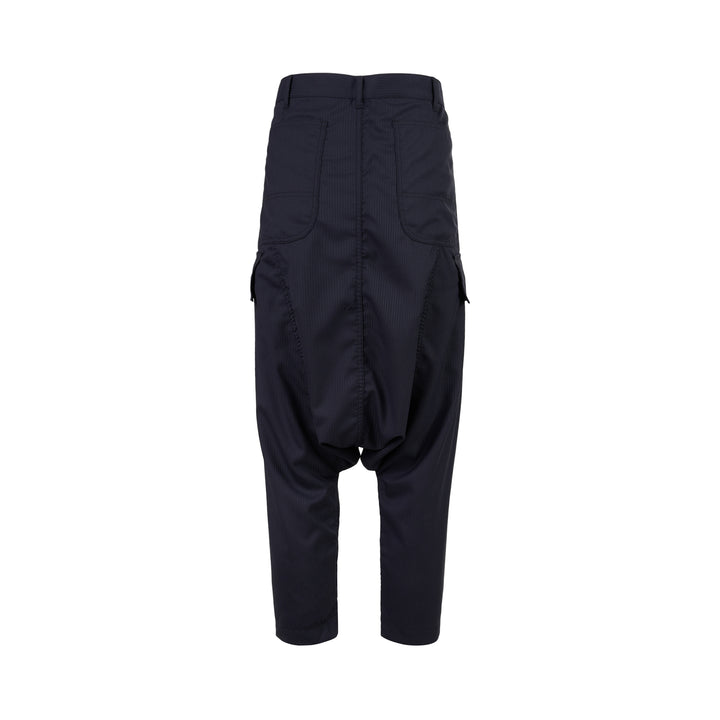 Comme des Garçons Shirt dark navy striped drop-crotch cargo pants with flap side pockets and cropped legs, shown from the front - view 2