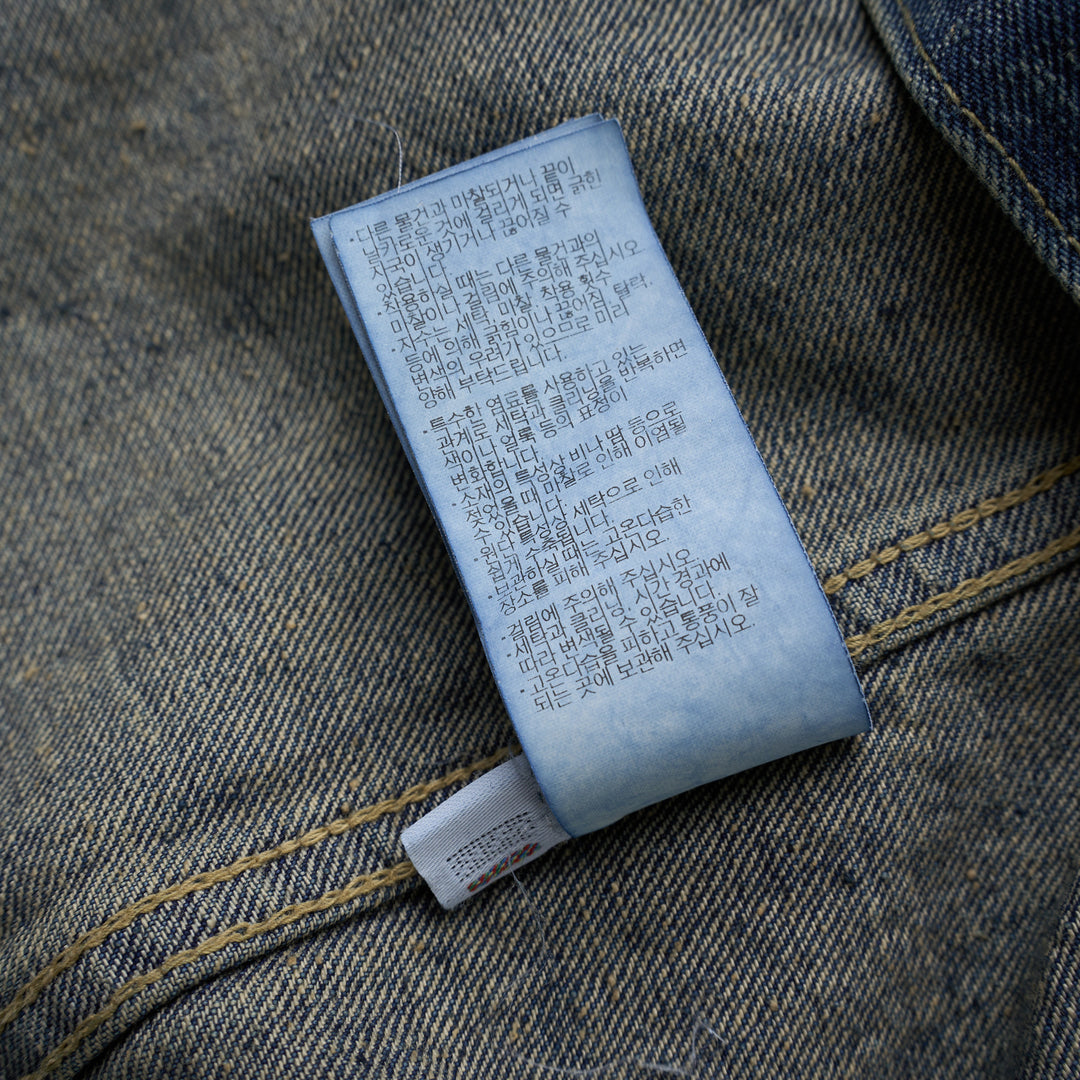 Human Made washed indigo denim work jacket with pleated front, button closure and heart-shaped logo patch on the chest - view 6