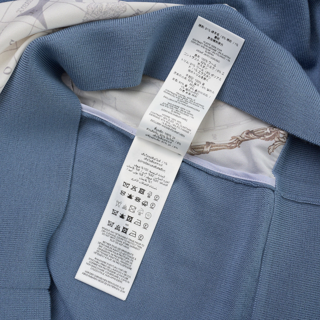 Zimmermann Valiant long sleeve polo with a silk front panel printed with a vintage world map and aeroplanes, framed by blue knit collar, sleeves, and hem - view 4