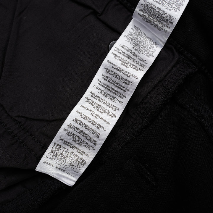 rag & bone Flexi Wren mid-rise full slim jeans in black stretch denim with five-pocket styling and rolled cuffs, shown from the front - view 5