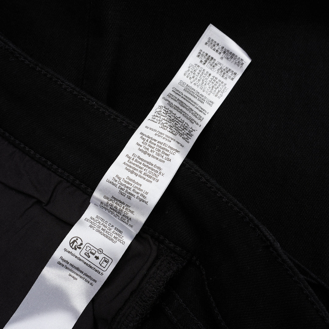 rag & bone Flexi Wren mid-rise full slim jeans in black stretch denim with five-pocket styling and rolled cuffs, shown from the front - view 6