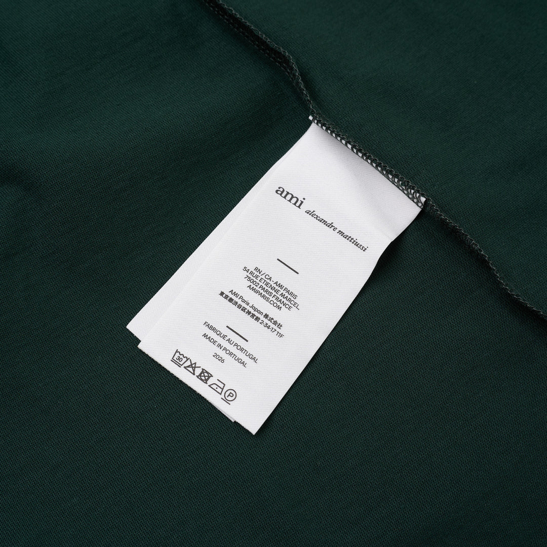 AMI forest green short-sleeve crew neck T-shirt with a small black Ami de Cœur embroidered logo at the chest - view 3