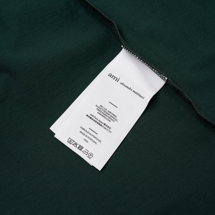 AMI forest green short-sleeve crew neck T-shirt with a small black Ami de Cœur embroidered logo at the chest - view 3