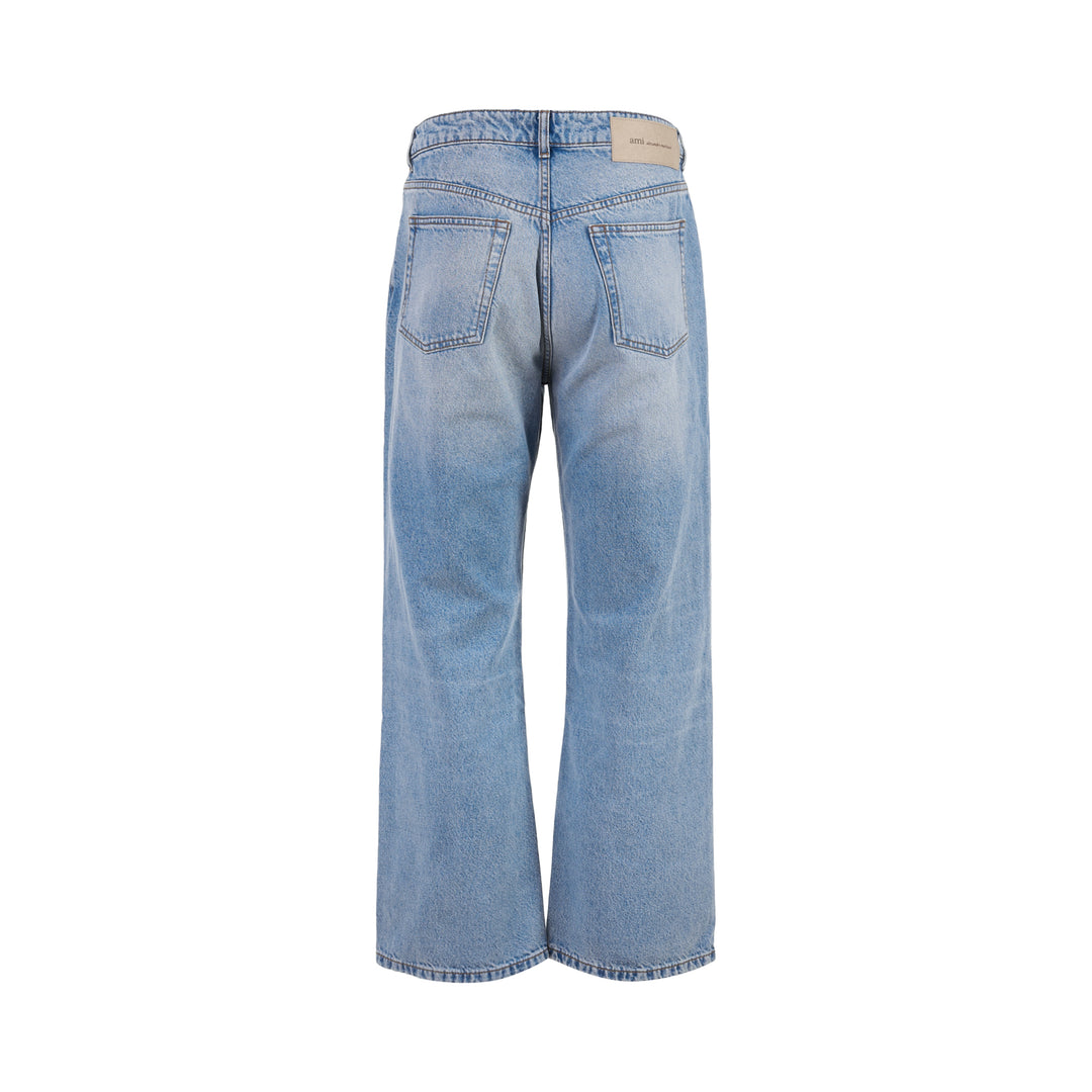 AMI large fit jeans in light washed blue denim with a wide straight leg, five-pocket design and button fly, shown front view - view 2