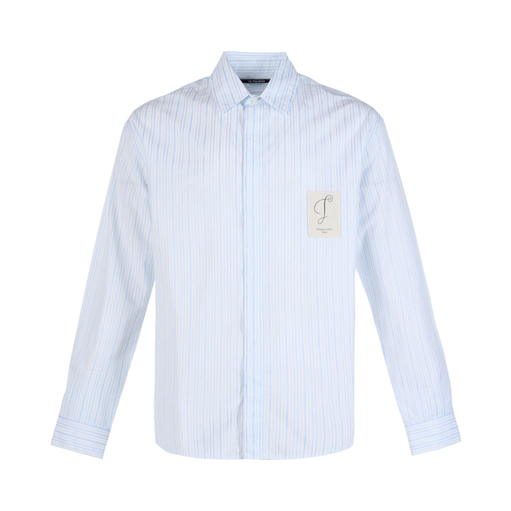 Jacquemus La Chemise Simon long sleeve shirt in light blue and white stripes with concealed placket and embroidered script patch on the chest