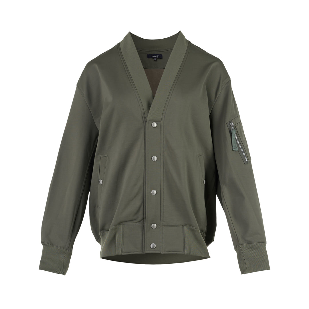 Comme des Garçons Homme olive green snap button cardigan with ribbed V-neck, sleeve zip pocket and ribbed hem