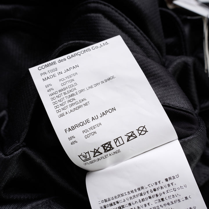 Comme des Garçons Homme Plus black gloss finish wide-leg flared pants with elasticated waistband, shown from the front - view 4