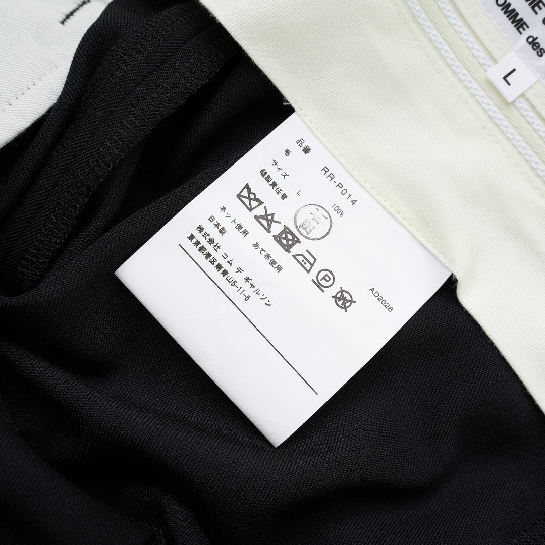 Black wool gabardine wide-leg pants with pleated skirt-like panels and high waist by Comme des Garçons Comme des Garçons - view 3