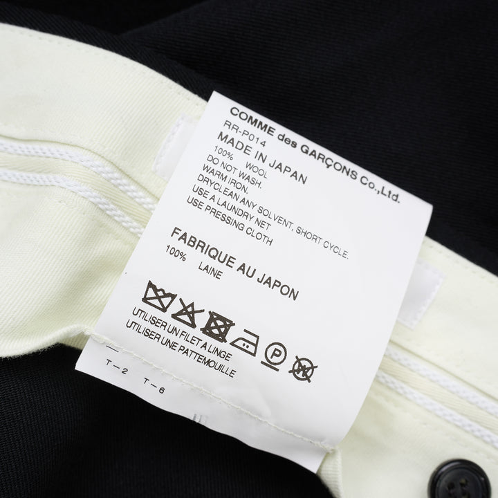 Black wool gabardine wide-leg pants with pleated skirt-like panels and high waist by Comme des Garçons Comme des Garçons - view 4