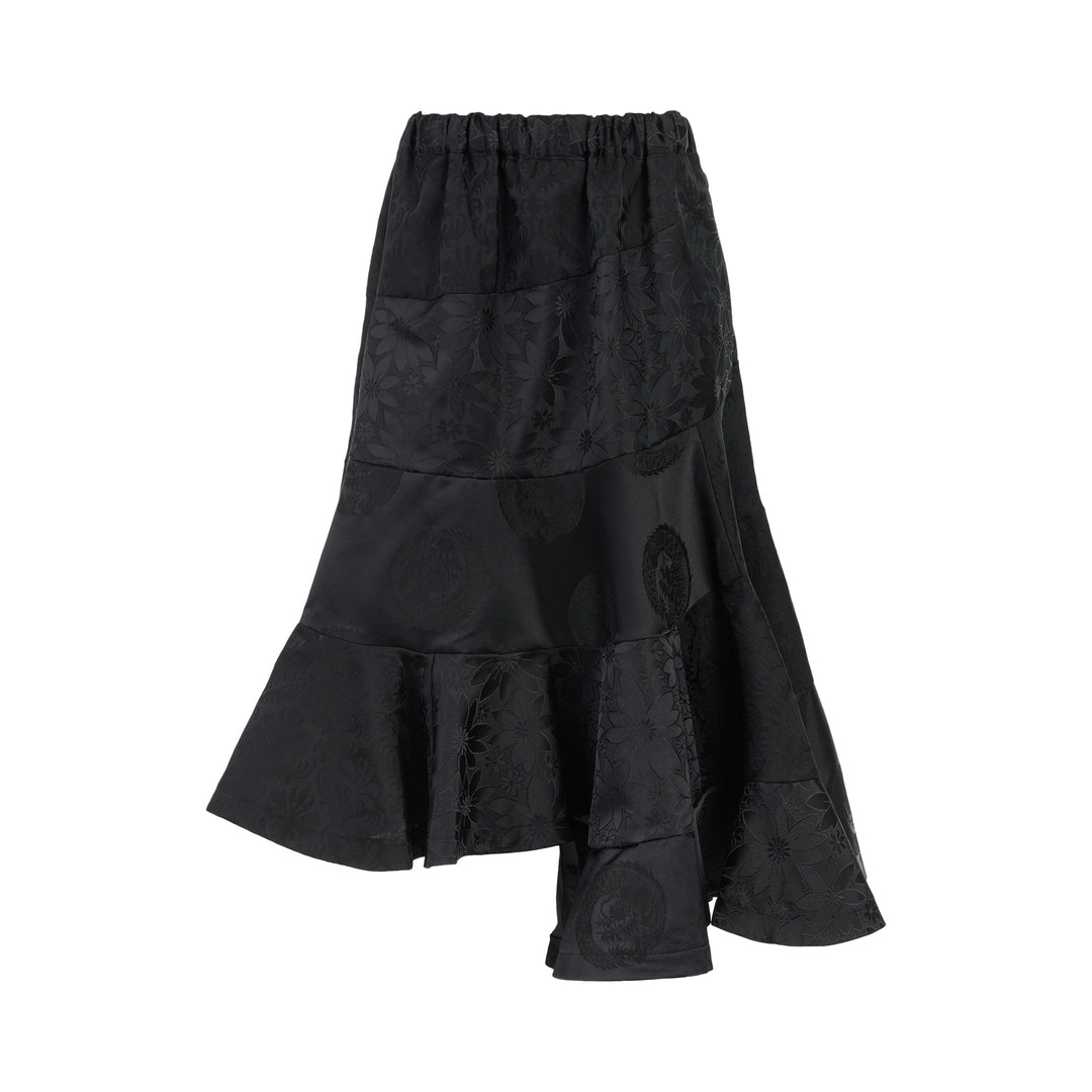 Black jacquard patchwork midi skirt with elasticated waist and asymmetric tiered flounce hem by Comme des Garçons Comme des Garçons