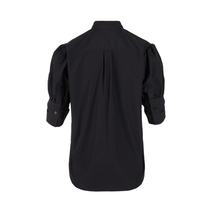 Noir Kei Ninomiya black button-up shirt with band collar, oversized bow with buckle straps across the chest and puffed elbow-length sleeves - view 2